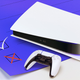 A PlayStation 5 sits on top of a blue checklist.